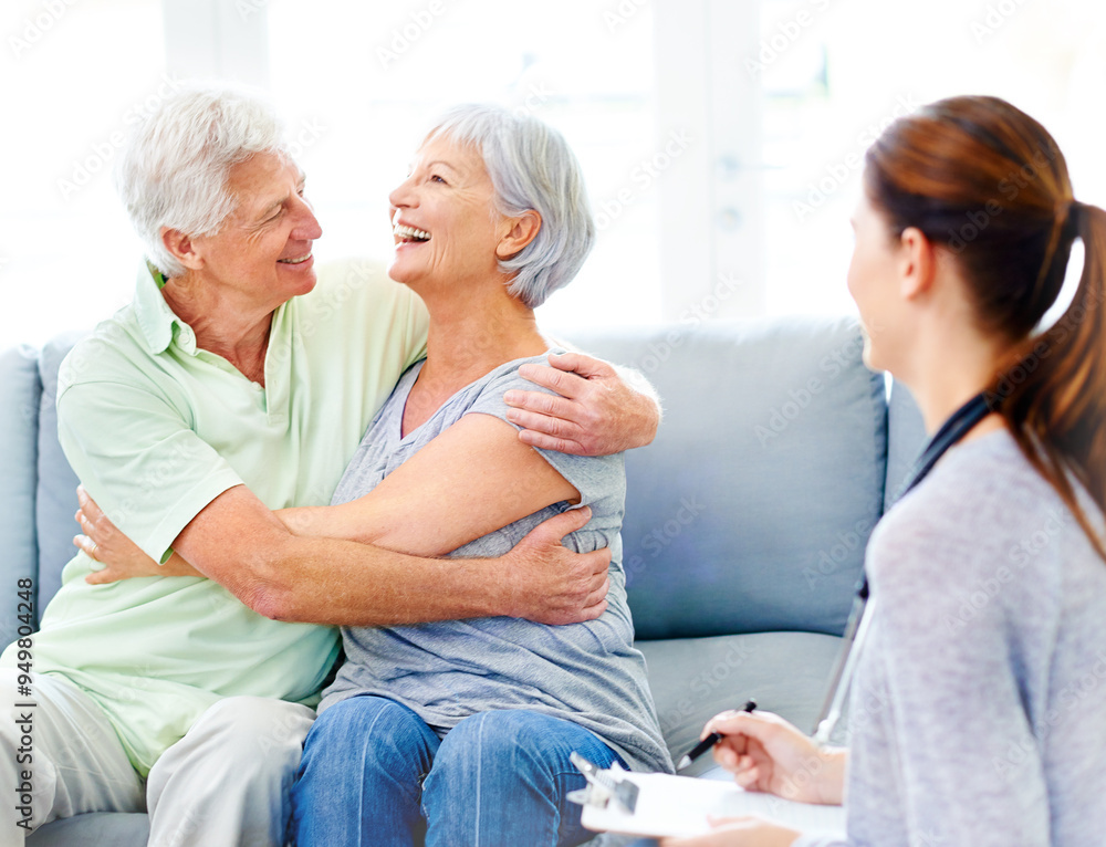 Obraz premium Senior couple, happy and embrace on couch in nursing home with good news, doctor or positive results. Old partners, hug or laugh with nurse or carer in retirement centre for diagnosis, test or health