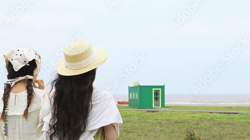 Zhoushan City, Zhejiang Province - Young people at the beach in the evening photo