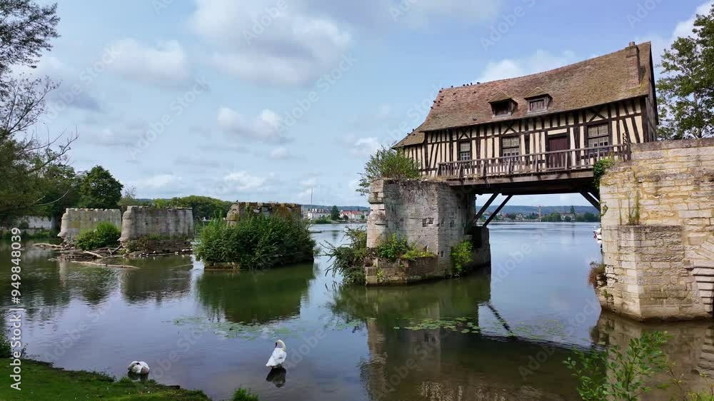 Le vieux moulin or the old mill and its quiet place with swans on the Seine, Vernon, France. Le vieux moulin or the old mill and its quiet place with swans on the Seine, Vernon, France.