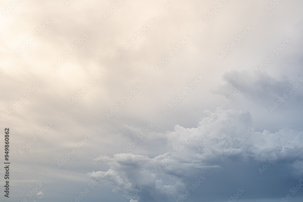 Dramatic rain clouds sky background. Gray clouds in the sky blocking the sun. Rain storm cumulus clouds with beautiful light. Dramatic rain clouds sky background. Gray clouds in the sky blocking the sun. Rain storm cumulus clouds with beautiful light.