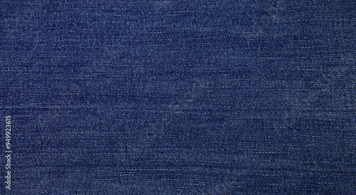 Dark blue jeans fabric background texture. 