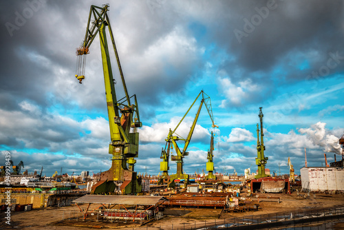 Industrial port crane in dock at sunset