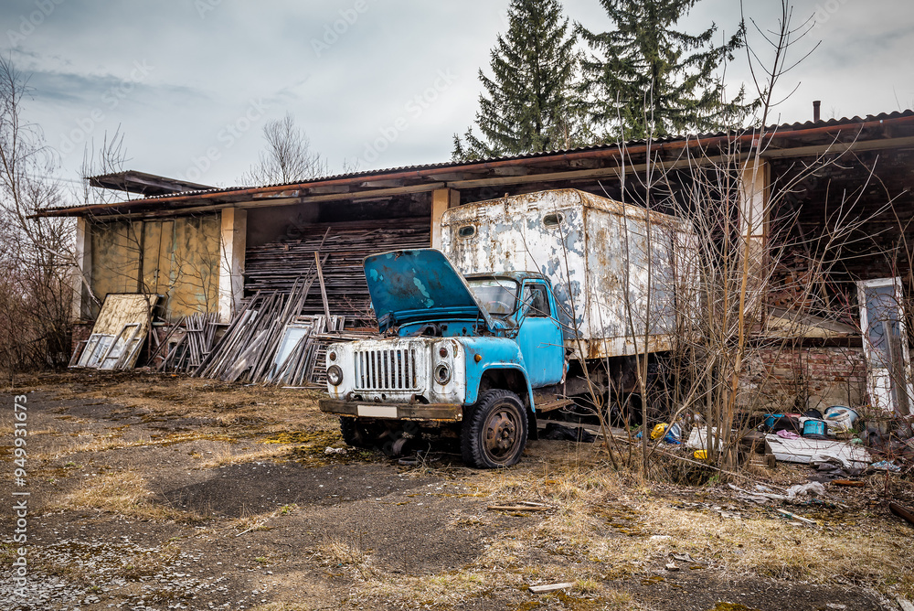 Fototapeta premium Wreck of old vintage truck in abandoned factory