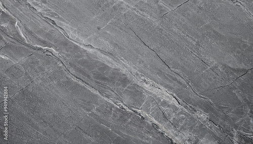 Sleek black limestone texture with polished light finish. Gray concrete surface. Marble slab effect.