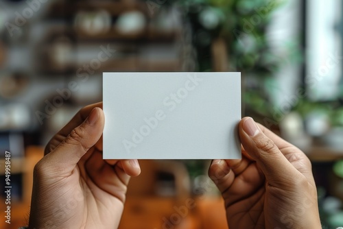 Blank White Card Being Held by a Hand