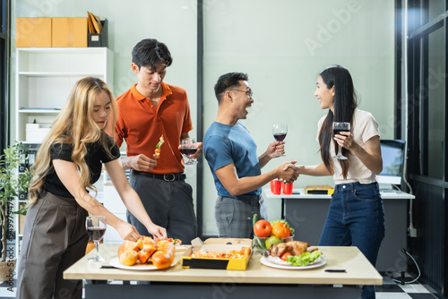 Successful business team, excited businessman feel happy work complete with champagne and pizza, celebration excellent financial results.