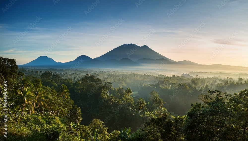 Fototapeta premium In the early morning hours of Bali island, a landscape of forests and mountains is seen, a scene of nature and travel