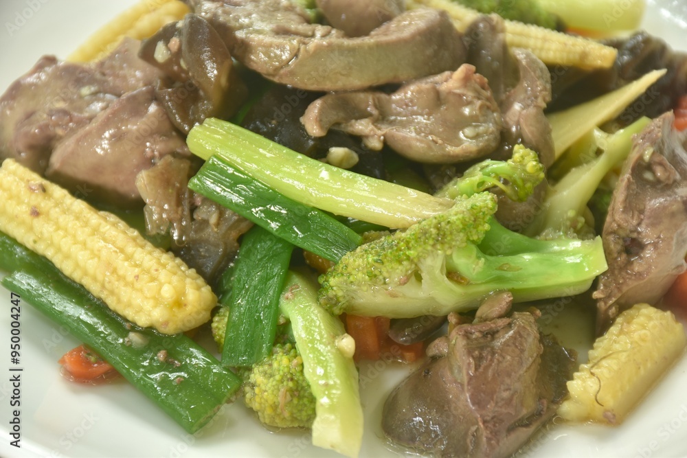stir fried mixed vegetable with chicken liver and gizzard on plate stir fried mixed vegetable with chicken liver and gizzard on plate