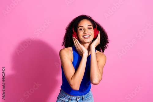 Photo portrait of attractive young woman headphones listen music dressed stylish blue clothes isolated on pink color background