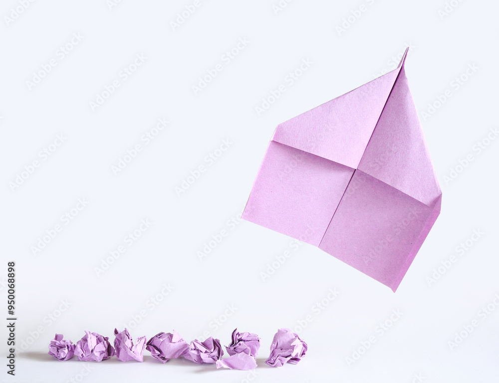 Fresh ideas for business transformation concept with crumpled paper balls and a paper plane taking off, start up, success, teamwork and creativity business concept, free copy space Fresh ideas for business transformation concept with crumpled paper balls and a paper plane taking off, start up, success, teamwork and creativity business concept, free copy space