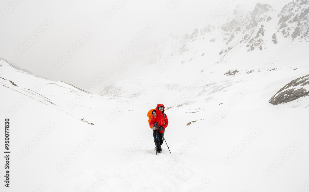 Male mountain climber on top of snowy peak. Male mountain climber on top of snowy peak.
