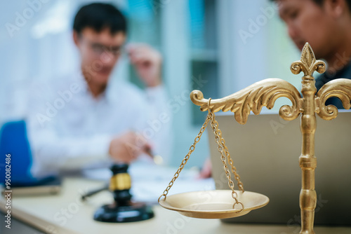 Two lawyers consult in a modern office, presenting compelling arguments and demonstrating their expertise, trying to win a case with their legal acumen and persuasive skills.
 photo