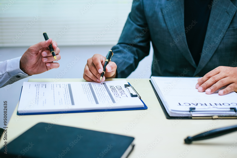 Two lawyers consult in a modern office, presenting compelling arguments and demonstrating their expertise, trying to win a case with their legal acumen and persuasive skills.
Two lawyers consult in a modern office, presenting compelling arguments and demonstrating their expertise, trying to win a case with their legal acumen and persuasive skills.