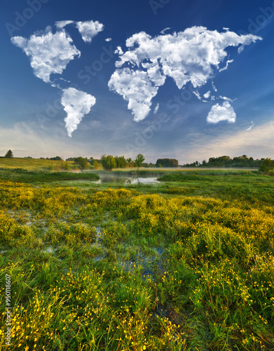 clouds in the form of a world map over a picturesque river. travel and landscape concept. spring meadow
