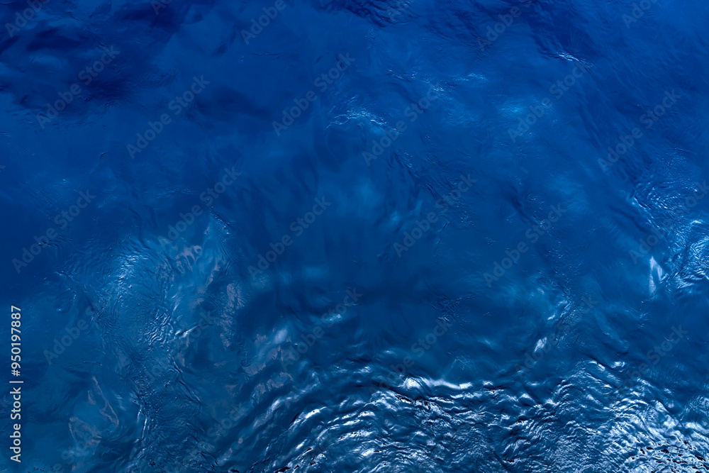 Top view of blue sea water. Blue water background. Top view of blue sea water. Blue water background.