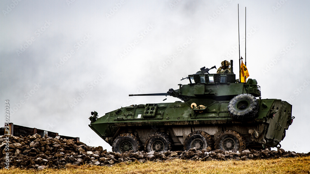 A military tank is driving through a muddy field A military tank is driving through a muddy field