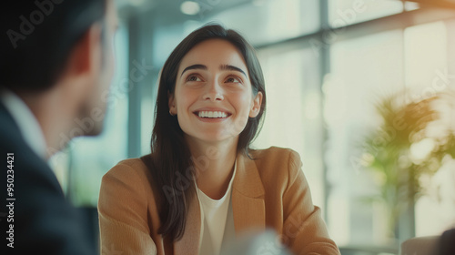 Fototapeta Naklejka Na Ścianę i Meble -  Happy middle aged business woman hr talking to recruit at job interview meeting. Smiling mature female financial advisor, professional bank manager consulting client working in corporate office