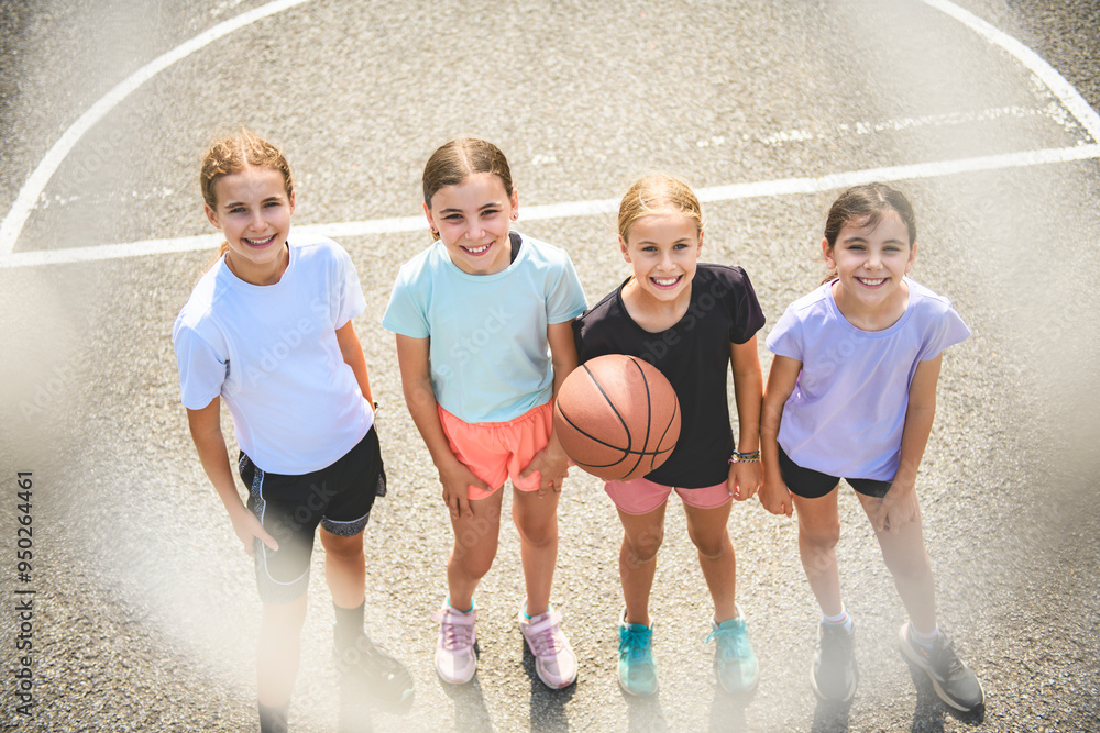Fototapeta premium Childs girls Team in sportswear playing basketball game