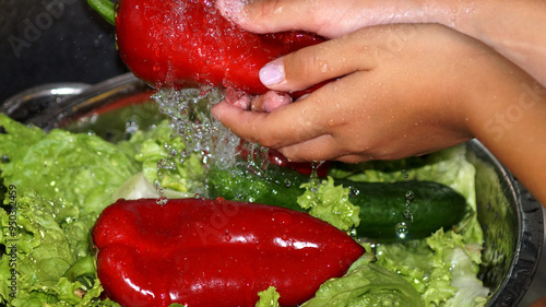 Woman washes vegetables. Healthy food . High quality photo