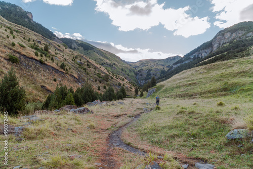 Panoramic landscape with a path in the mountains, on a sunny day. In Pirineos, Huesca (Spain).