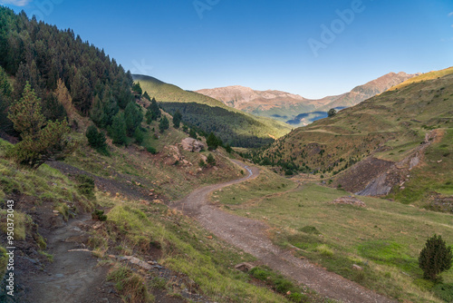 Panoramic landscape with a path in the mountains, on a sunny day. In Pirineos, Huesca (Spain).