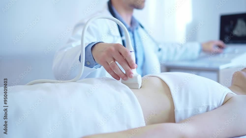 Doctor man wearing a white coat using an ultrasound machine on a female patient examining internal organs. Preventive therapy in medicine Doctor man wearing a white coat using an ultrasound machine on a female patient examining internal organs. Preventive therapy in medicine
