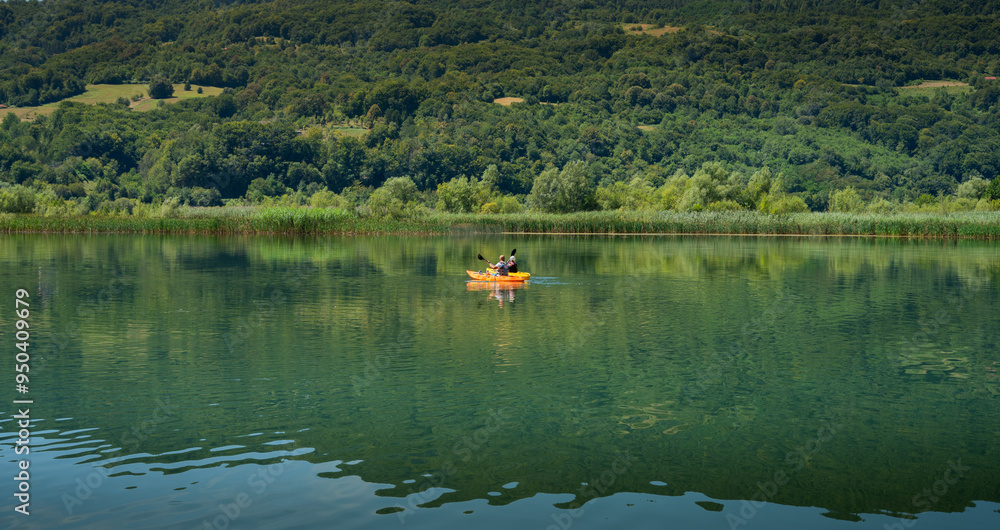 father and daughter are kayaking on the lake father and daughter are kayaking on the lake