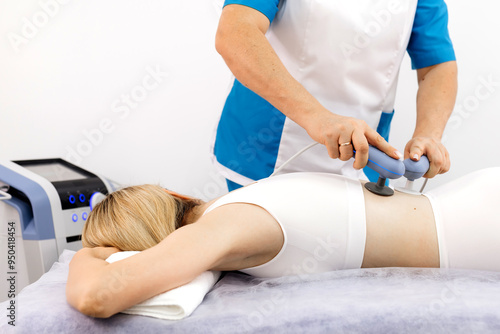 Modern TR-THERAPY diathermy session at a clinic, focusing on pain relief and muscle recovery. Perfect for illustrating innovative physiotherapy methods and cutting-edge wellness treatments.