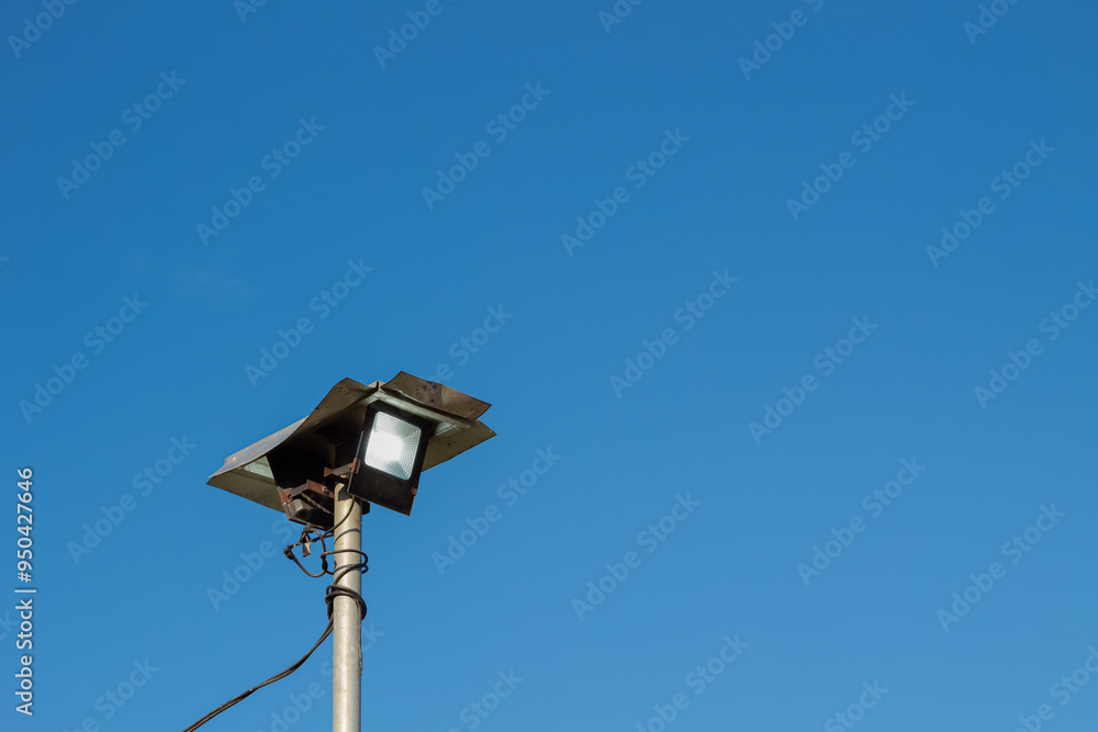Public street lights with a bright blue sky background Public street lights with a bright blue sky background