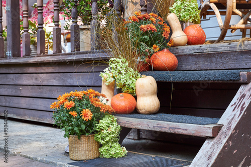 Autumn entryway decor, staircase decor with pumpkins and fall flowers