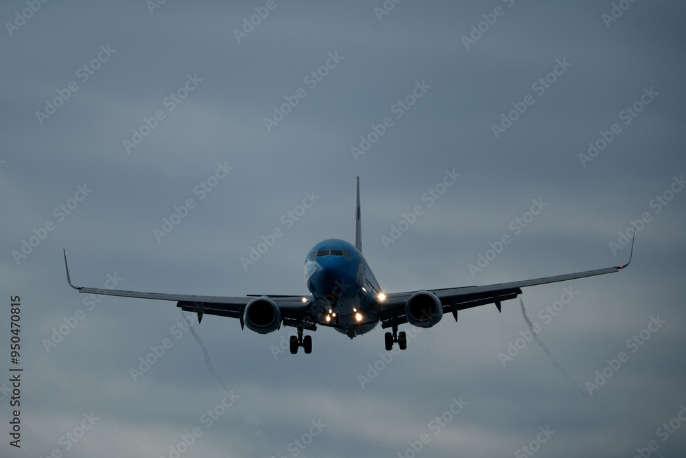 Airplane in the cloudy sky. Landing. Airplane in the cloudy sky. Landing.