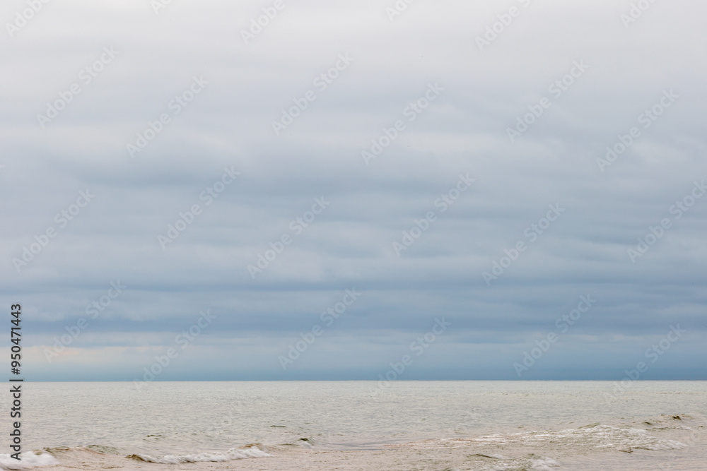 Fototapeta premium Threatening storm clouds form over Lake Michigan in late Ausgust off the coast of Harrington Beach State Park, Belgium, Wisconsin