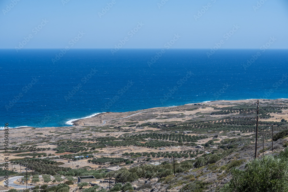 Fototapeta premium panoramic view of an ancient fortress in a bay against the backdrop of the sea on a sunny day on the island of Crete in Greece