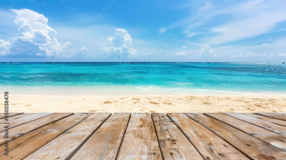 Naklejka premium Serene ocean view with a wooden deck overlooking a stunning beach and crystal-clear water under a bright blue sky.