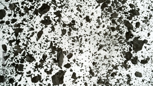 Charcoals with dust explosion, close up, top view on white background