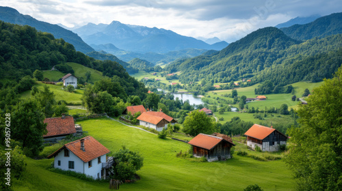 A scenic mountain village nestled in green hills, featuring traditional houses with red roofs and surrounded by lush nature.