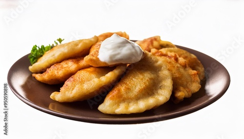 polish fried dumplings pierogi topped with sourcream photo