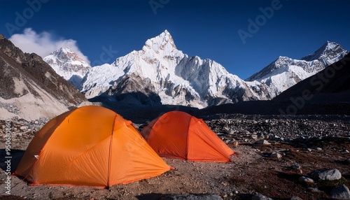 two illuminated tents at lobuche east basecamp with the peaks of taboche and cholatse in the background in nepal s khumbu region photo