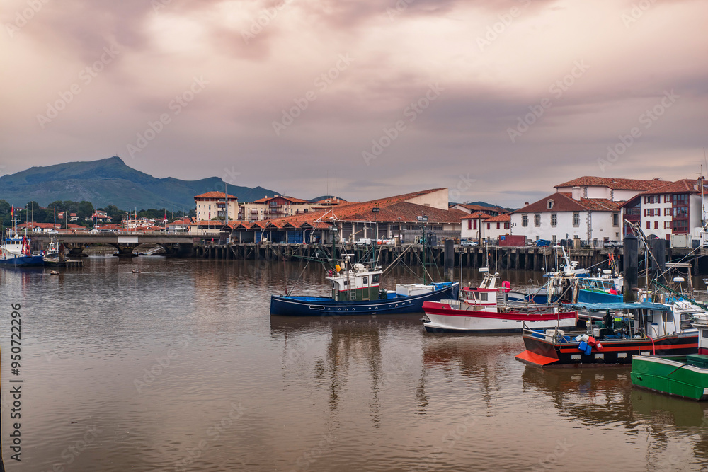 Fototapeta premium Town of Saint Jean de Luz in the Basque country in France, with boats in the port