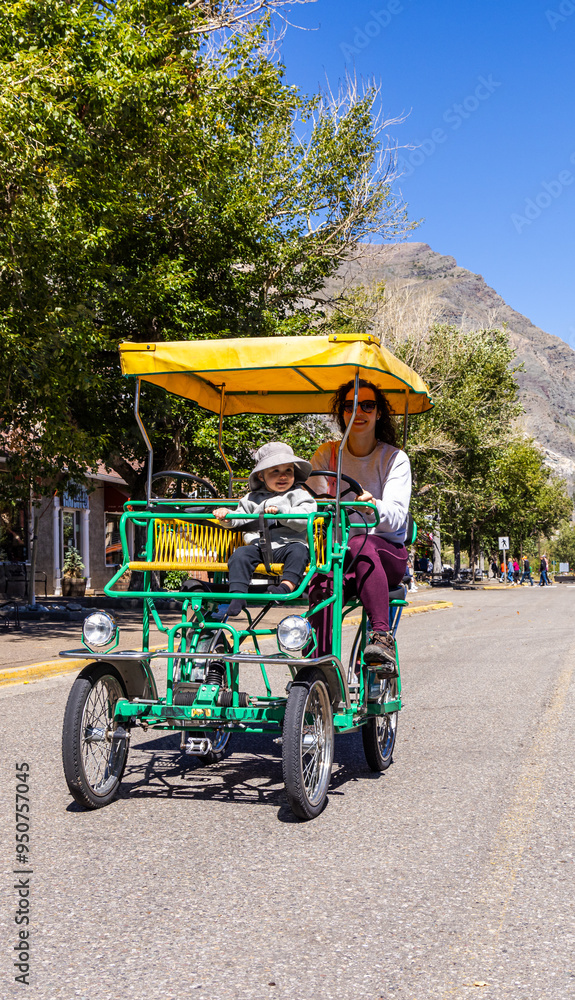 Mother and Child Enjoying Bicycle Ride in Waterton, Alberta Mother and Child Enjoying Bicycle Ride in Waterton, Alberta