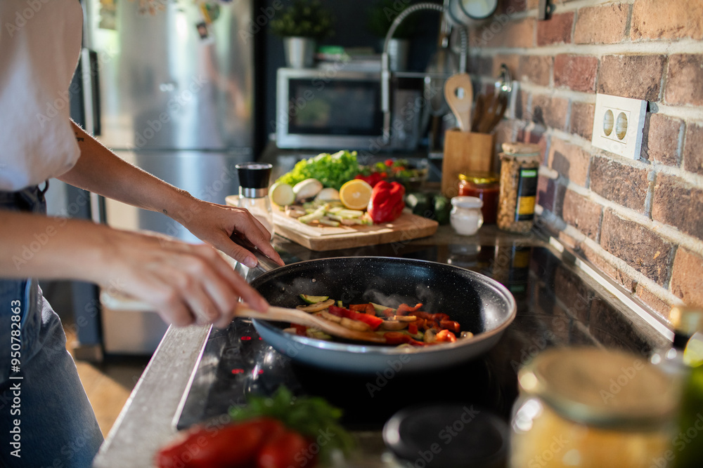 Young woman preparing fresh vegetables in a modern kitchen Young woman preparing fresh vegetables in a modern kitchen