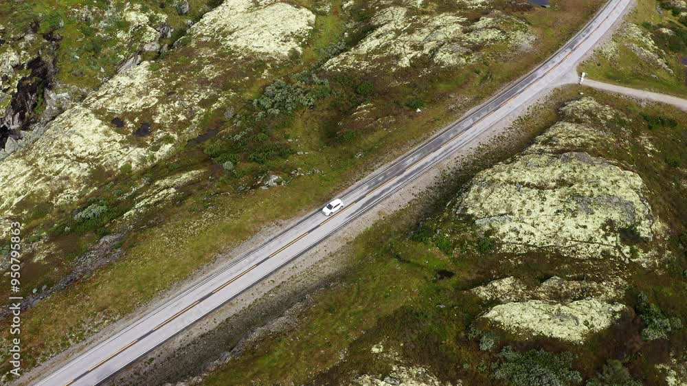 Lonely White Road driving throught Norvegian severe Tundra nature. Picturesque northern Norway landscape highway construction aerial 4K video in Nærøyfjord Heritage Park Norway. Lonely White Road driving throught Norvegian severe Tundra nature. Picturesque northern Norway landscape highway construction aerial 4K video in Nærøyfjord Heritage Park Norway.