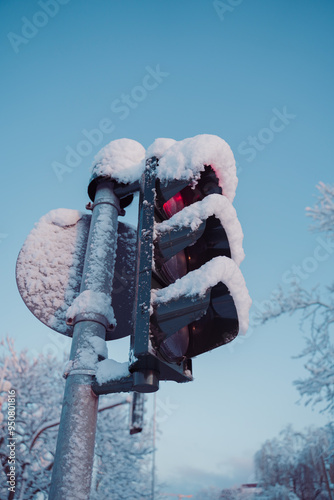 Red Trafficlight Covered with Snow Close Up
