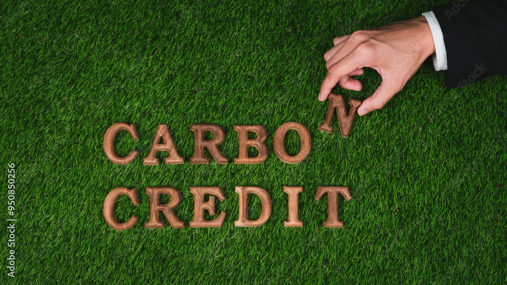 Hand arrange wooden alphabet text in CO2 on biophilic green grass design background as eco symbol for encouraging message for carbon credit reduction campaign and environmental awareness. Gyre Hand arrange wooden alphabet text in CO2 on biophilic green grass design background as eco symbol for encouraging message for carbon credit reduction campaign and environmental awareness. Gyre