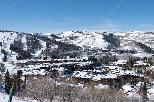 Deer Valley resort from afar, with ski runs in background, snow covred rooftops, Deer Valley, UT, February 3, 2023 photo