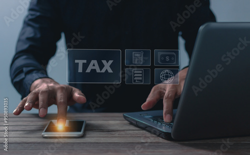 Fotografie Hand young man uses smaetphone and laptop for Signing tax online, Offers online