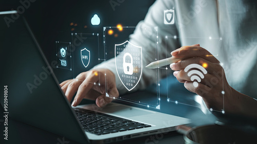 Person’s Hand Holding Stylus Interacting with Digital Interface on Laptop Displaying Security Icons, Including Shield with Padlock, Wi-Fi, Cloud, on Dark Background, Cybersecurity System, Technology,  photo