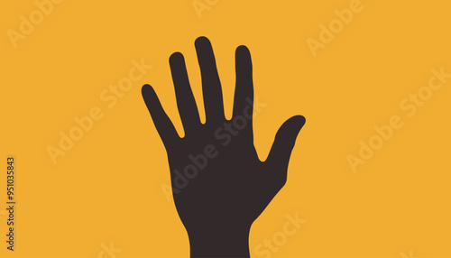 Silhouette of a hand against a bright yellow background, creating a striking contrast. photo