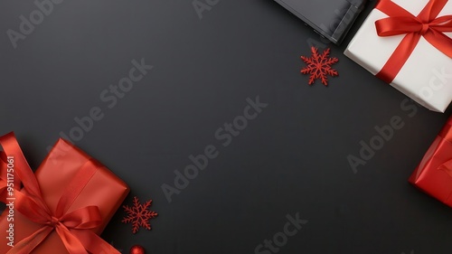 Minimalist flat lay of electronics gifts with holiday ribbons and subtle Black Friday discount tags, set against a dark background
