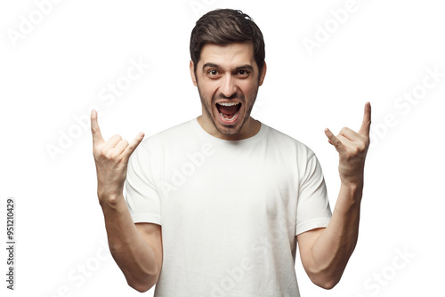 Young man showing rock gesture with his fingers as if listening to favourite music